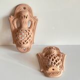 Pair of terracotta wall candle holders