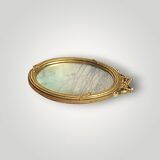 Antique oval wall mirror in gilded resin – Louis XVI knot –