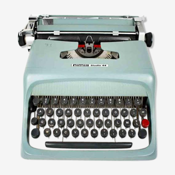 Machine à écrire Olivetti Studio 44 dans son étui avec la clef du coffret