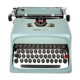 Machine à écrire Olivetti Studio 44 dans son étui avec la clef du coffret