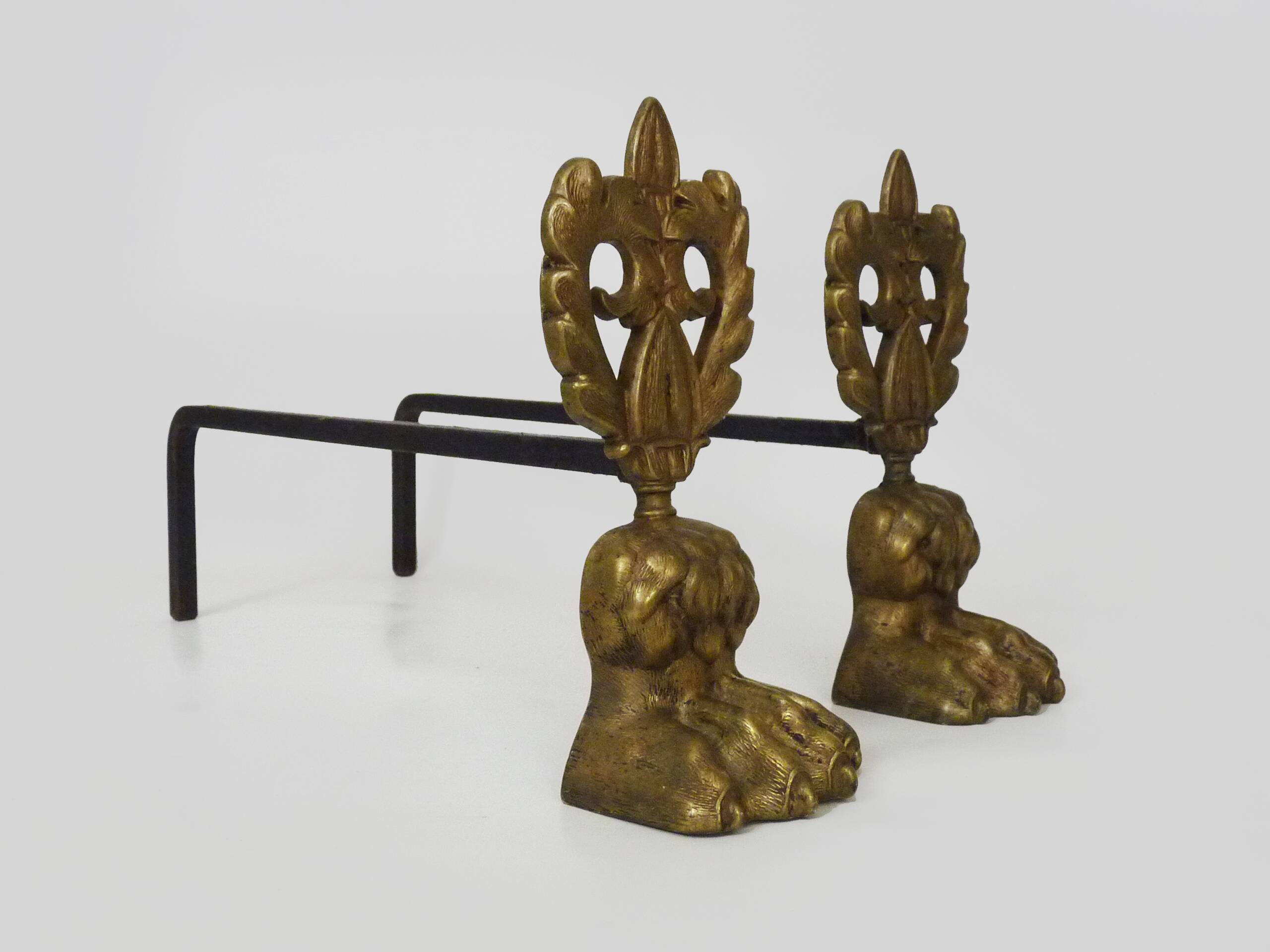 Pair of bronze fire dogs with lion paws. Early 20th century.