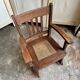 Children's rocking chair in dark wood and cane