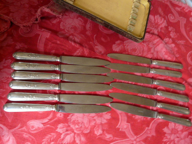 Series of 12 antique silver metal knives in their box