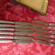 Series of 12 antique silver metal knives in their box