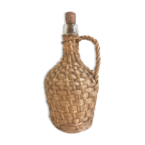 Old lady-jeanne dressed in vintage rattan