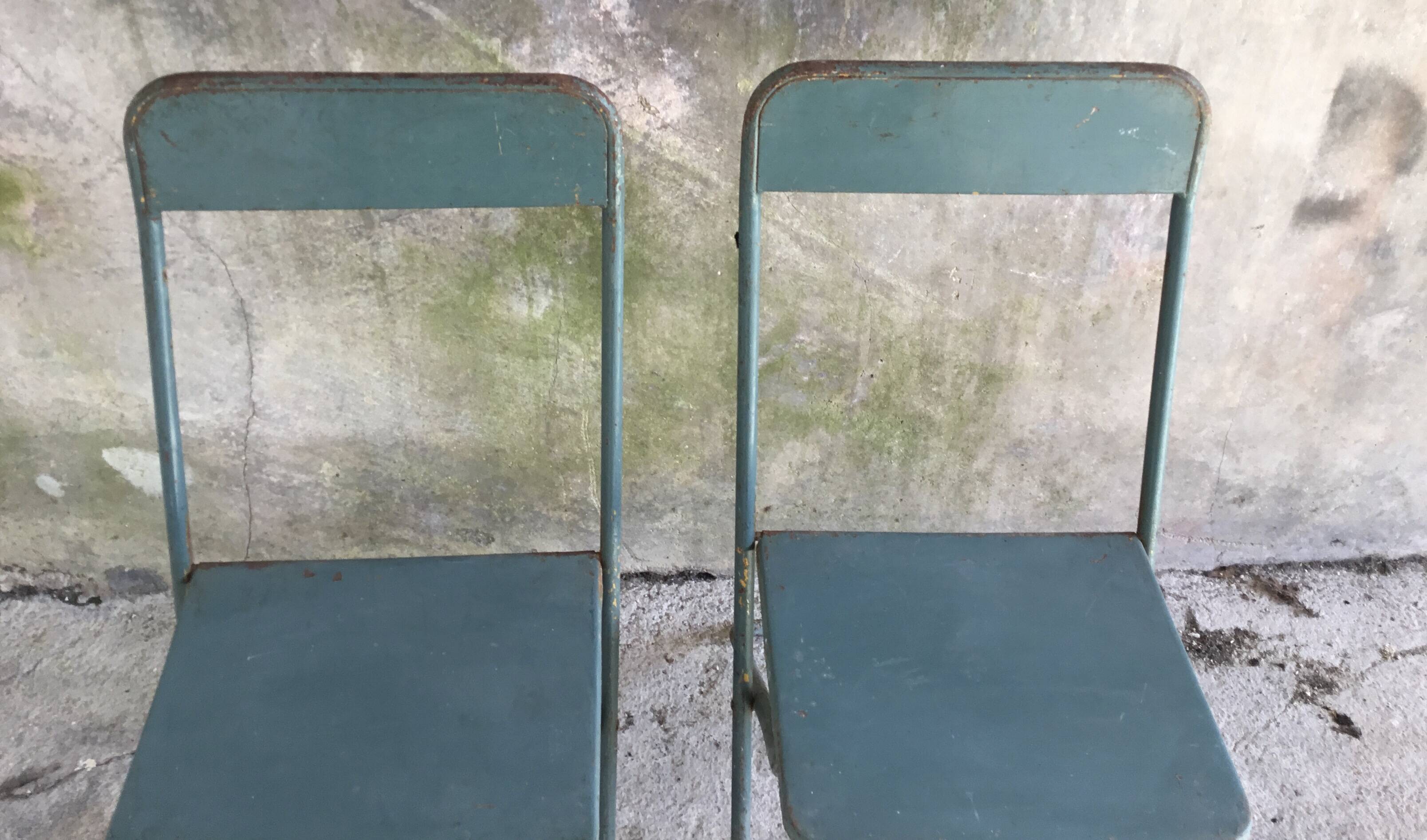 Pair of folding metal chairs, military or industrial, mid-20th century.