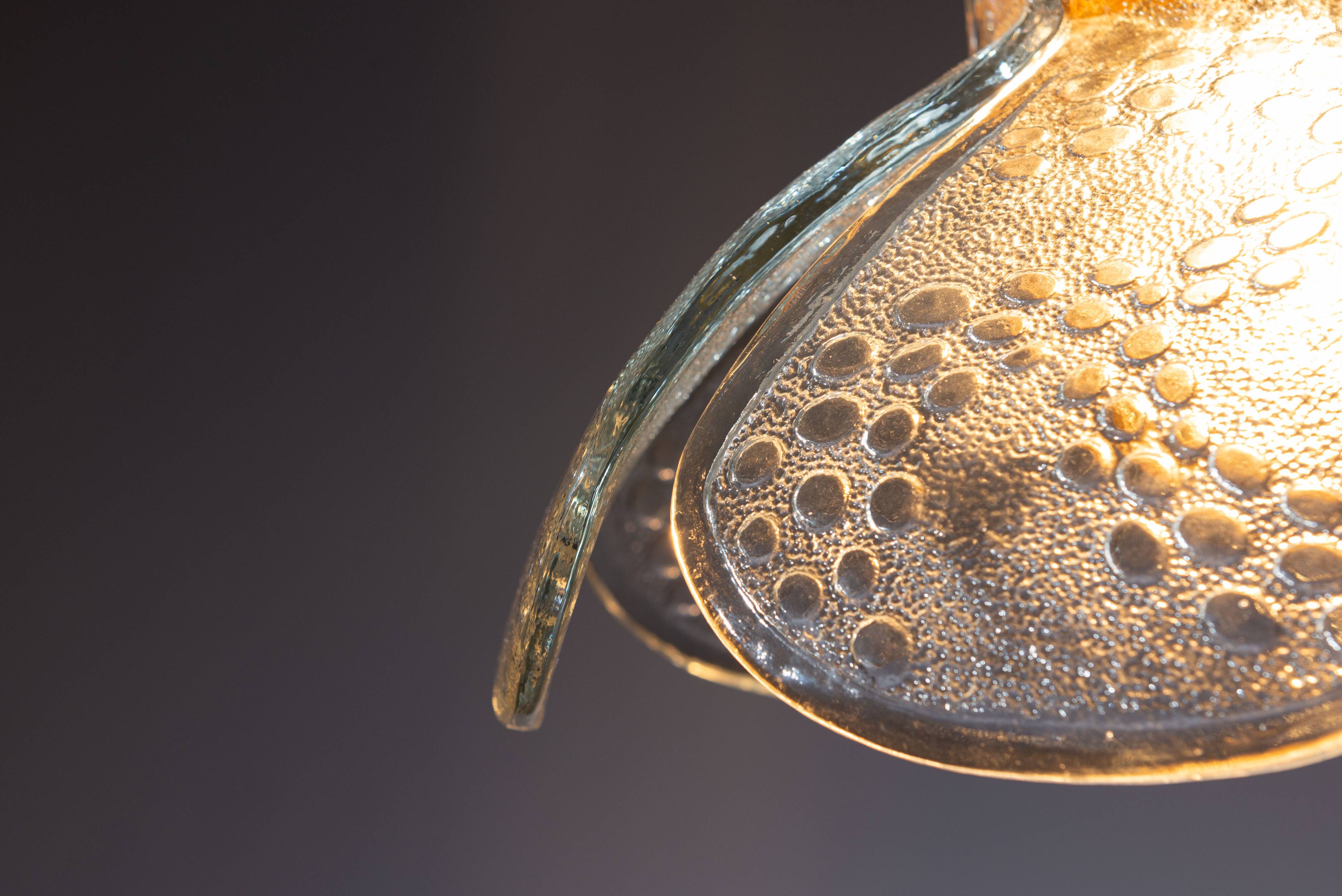 Swedish pendant with glass leaf shades and a center shade of amber coloured