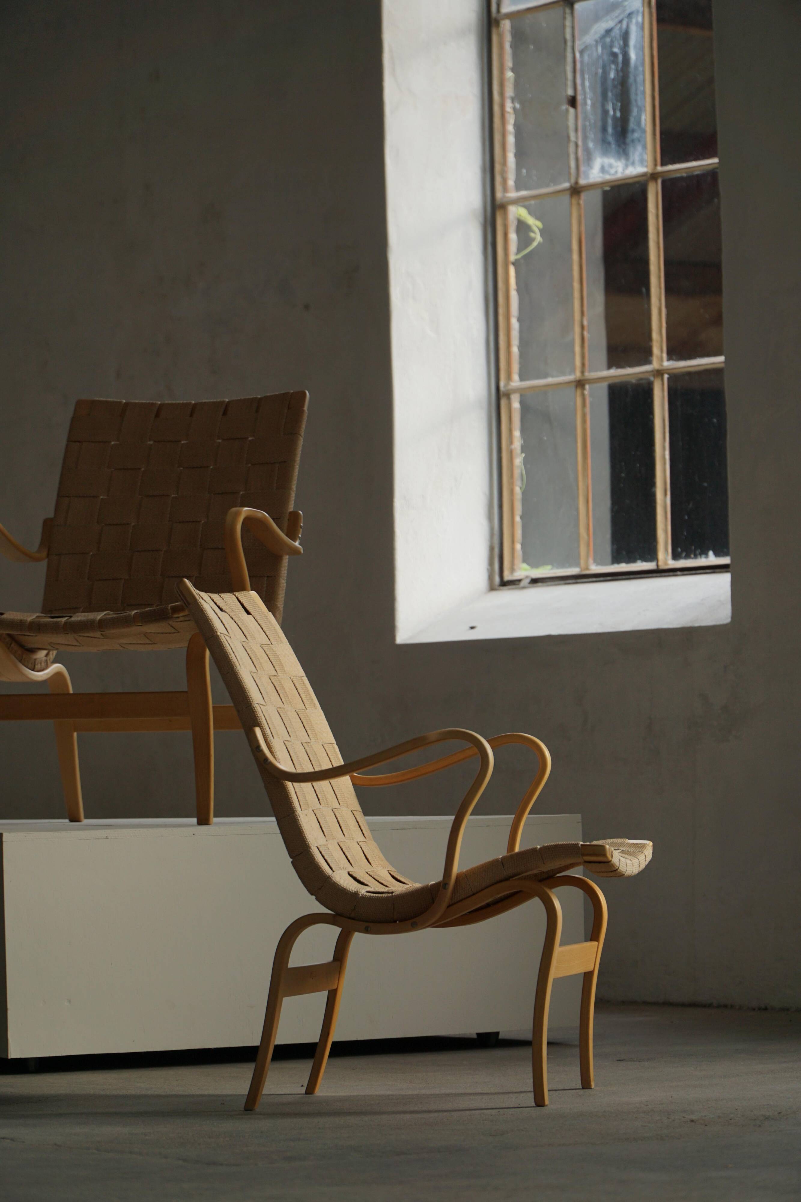 Pair of Swedish armchairs from the mid-century by Bruno Mathsson, model "Eva", 1960s.