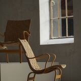 Pair of Swedish armchairs from the mid-century by Bruno Mathsson, model "Eva", 1960s.