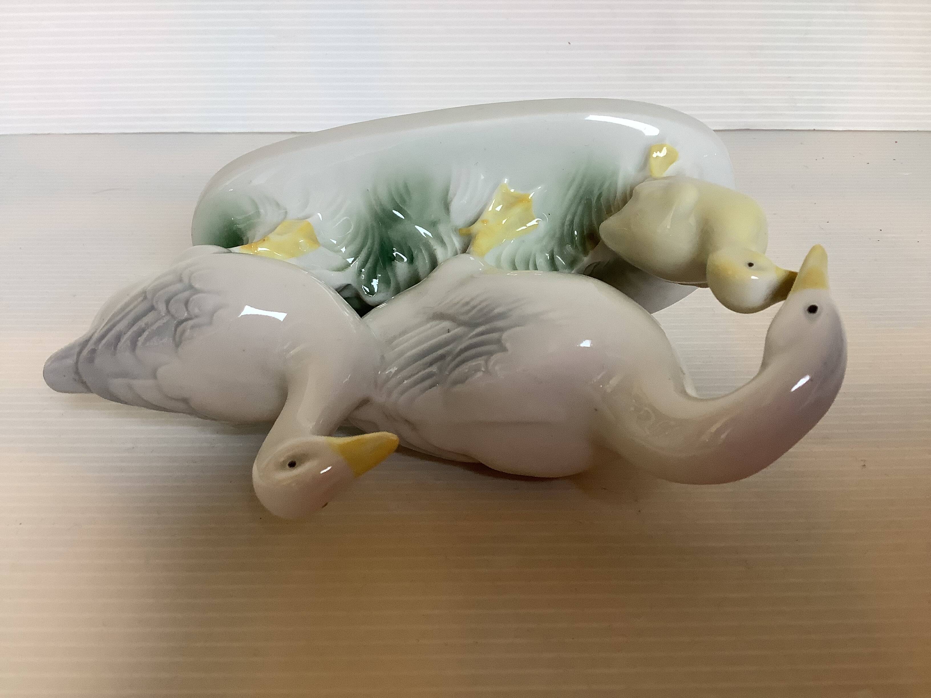 Trio of ceramic geese