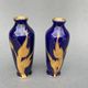 Pair of 1900 Limoges vases with blue background and gold highlights, R. Rosier decorations
