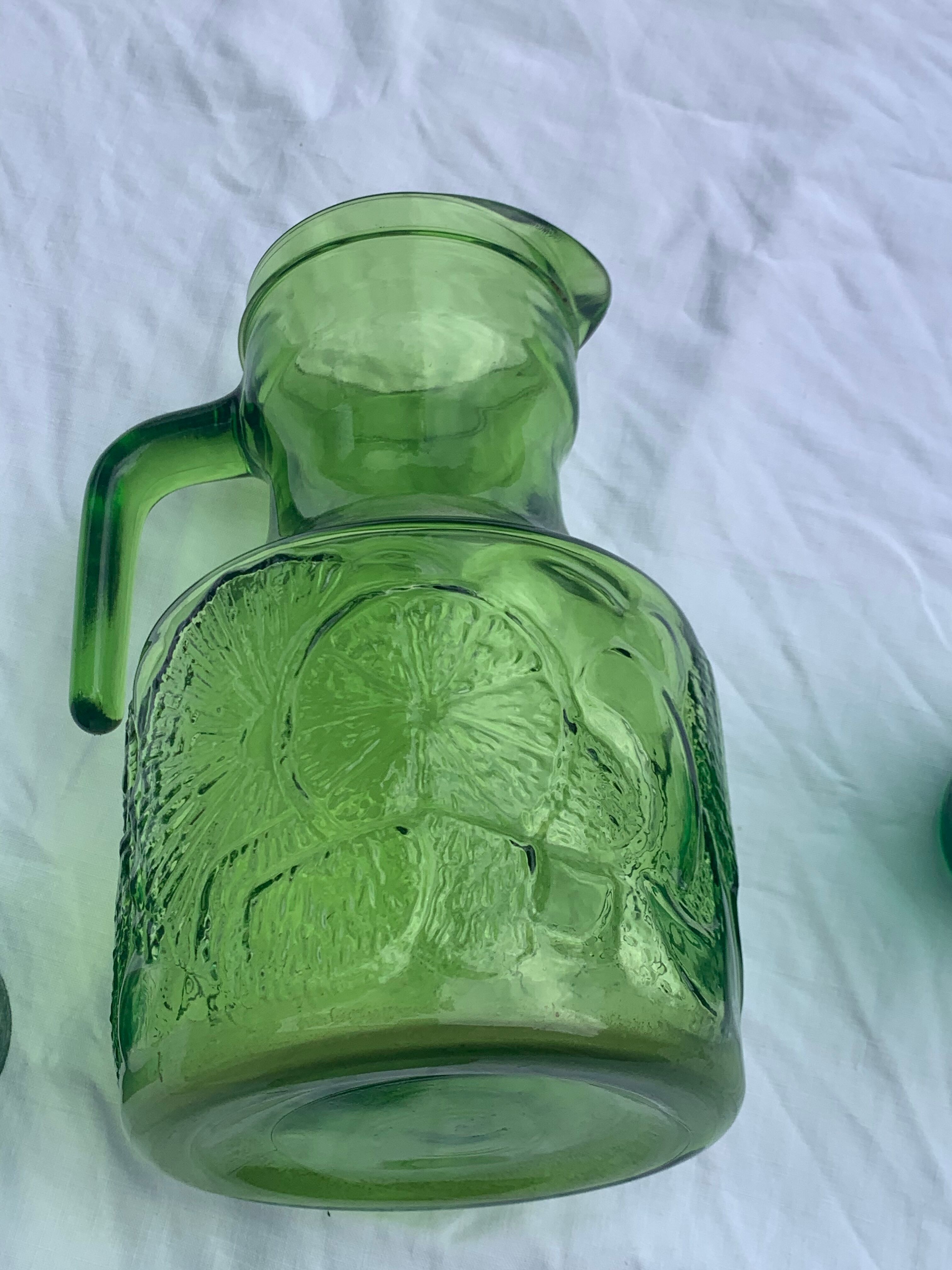 Carafe and 3 green glass glasses with vintage embossed fruit pattern