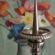 Old church candlestick in silver-plated metal
