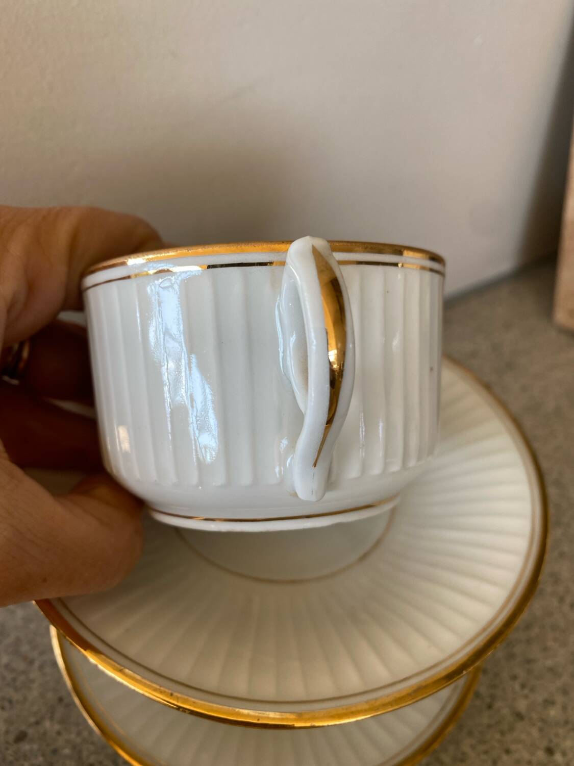 3 white and gold tea or chocolate cups