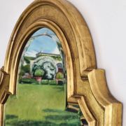 Florentine arched mirror in gilded wood with gold leaf.