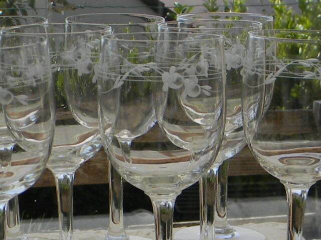 Set of 8 antique glass water glasses. Engraved floral border