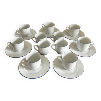 Set of 11 white cups and 7 saucers with blue trim by Guy Degrenne