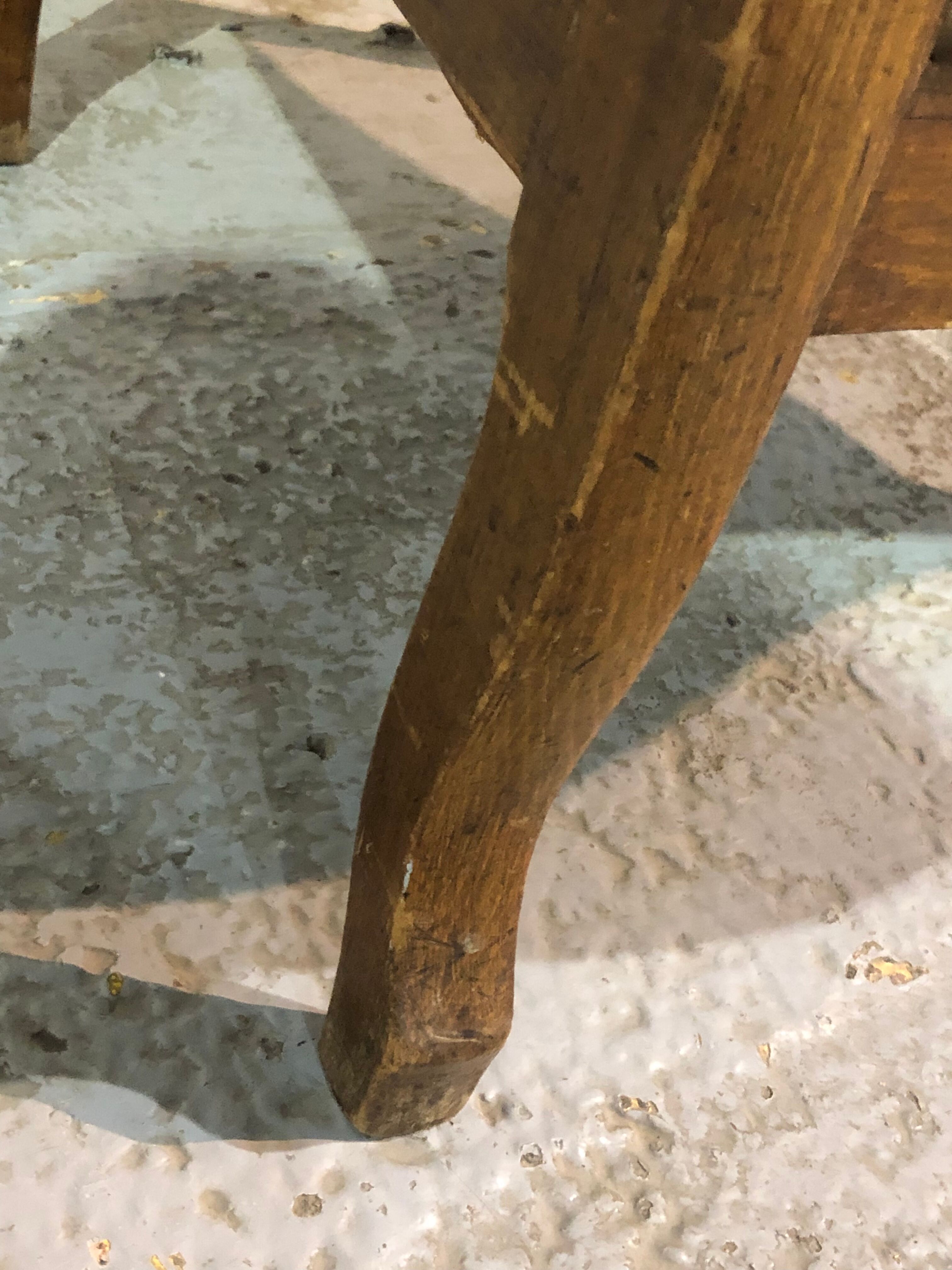 Old Voltaire armchair in light brown leather