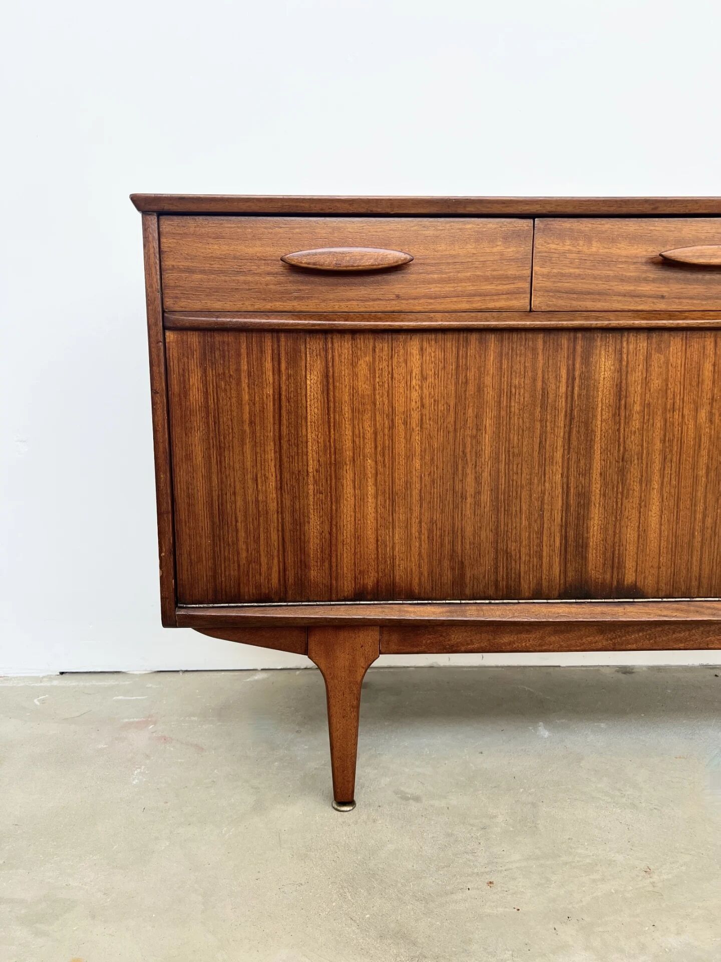 Teak Jentique sideboard — 1 door, 2 drawers & drop-down bar, England 1950s-60s