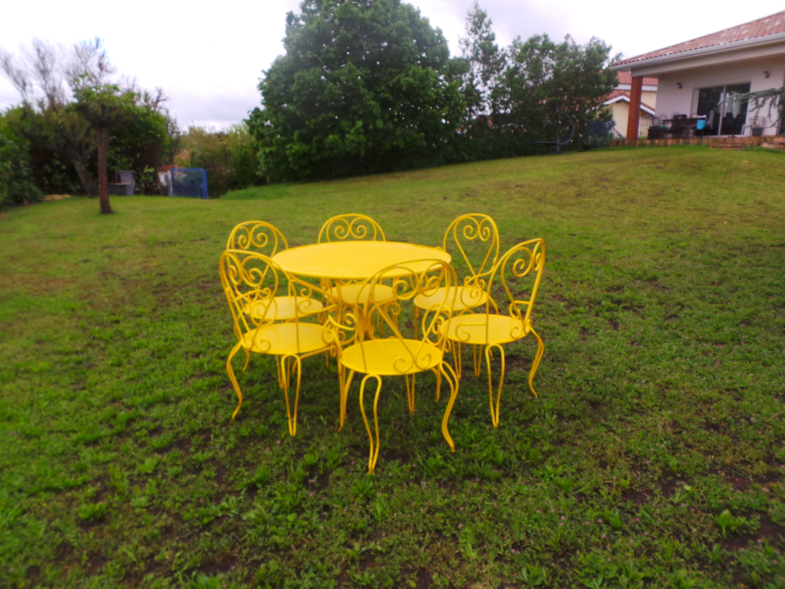Yellow wrought iron garden room