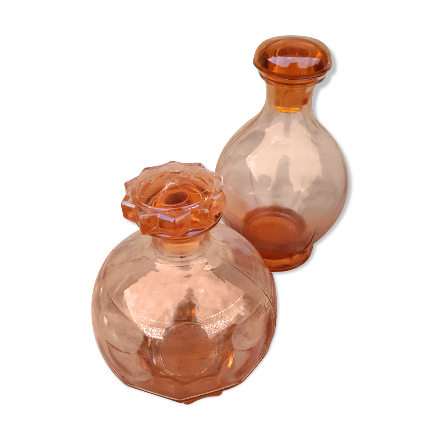 Duo of vintage pink glass bottles