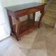 Empire/Restoration style console table with scrolled ends, mirrored back, and claw feet.