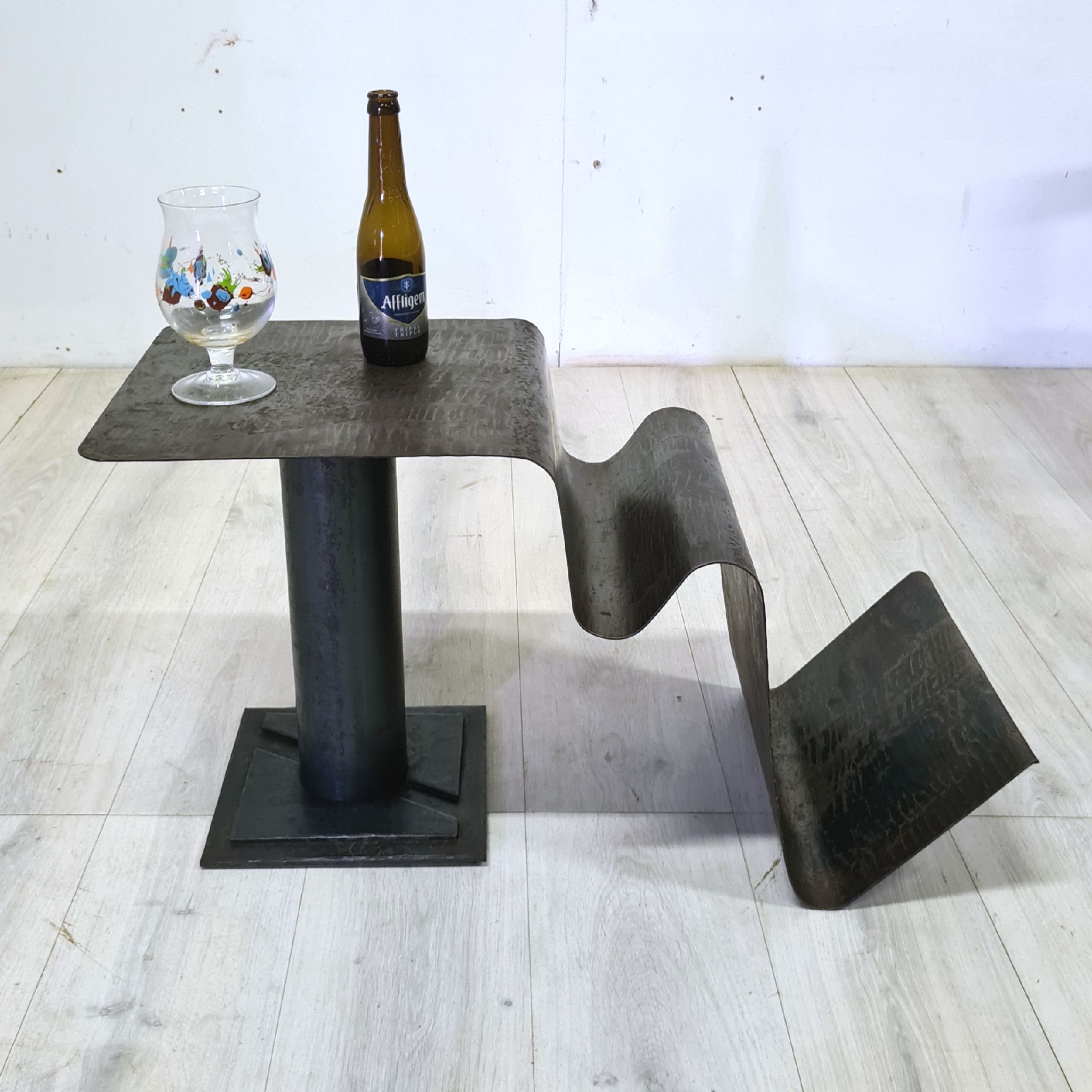 Curved sheet metal side table with magazine stand, 1980s