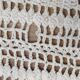 White two-seater crocheted bed top