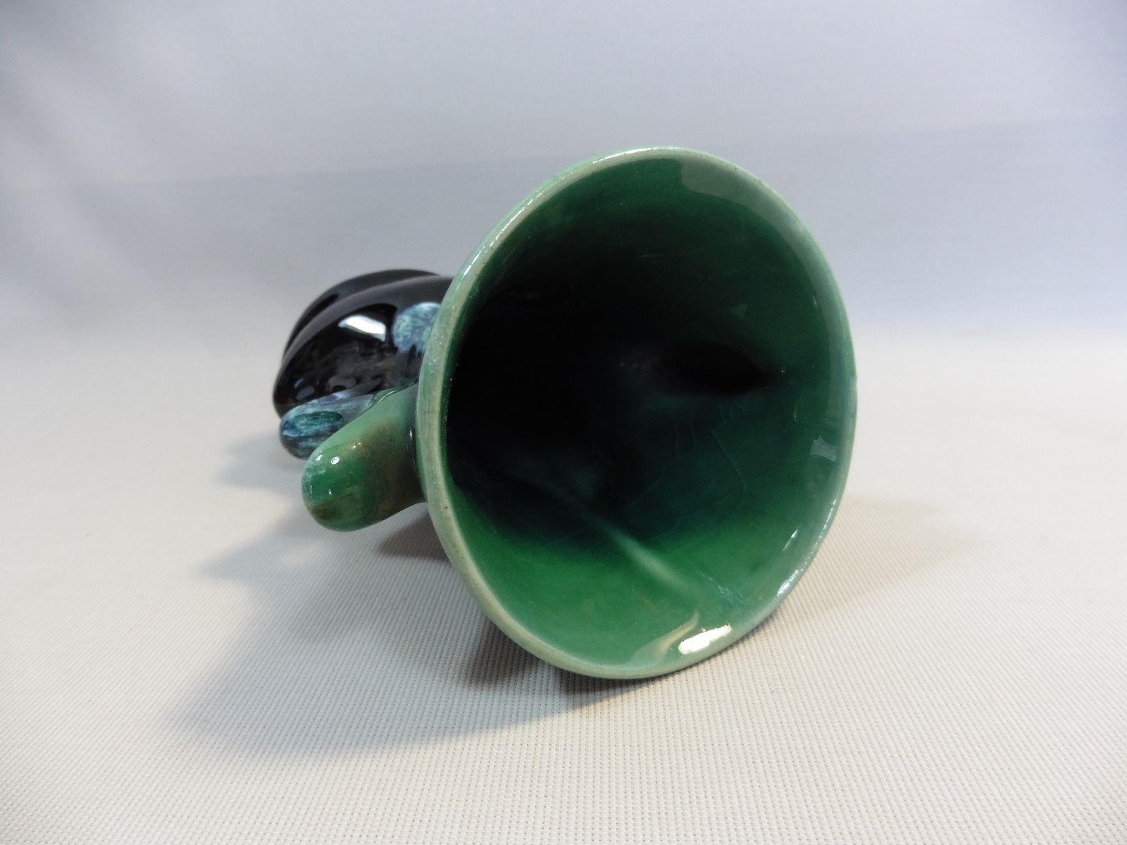Praticality black and green vase numbered 666