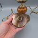 Hollywood Regency bedside lamp in gold metal with a glass globe.