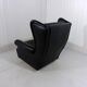 Fauteuil à oreilles en cuir noir sur roulettes années 1960