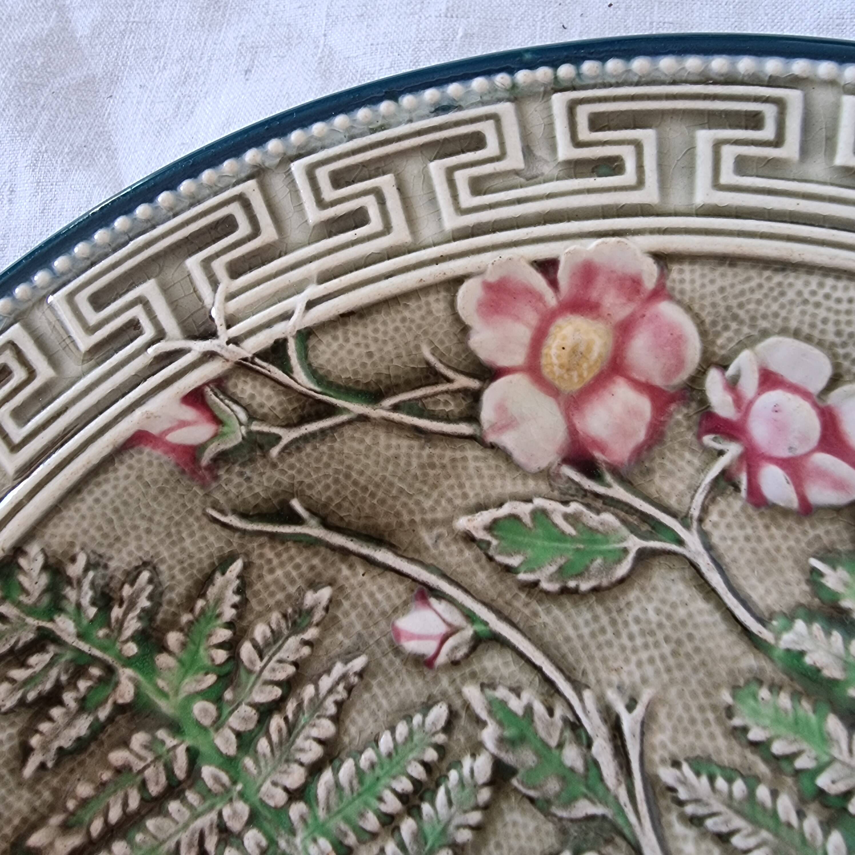 Choisy Le Roi majolica or barbotine dish decorated with leaves and pink flowers from the 19th century