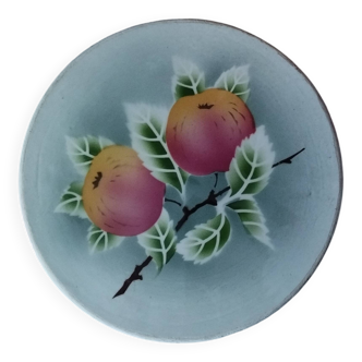 Antique round earthenware trivet with Digoin stenciled fruit motif.