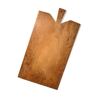 Cutting board in old raw wood