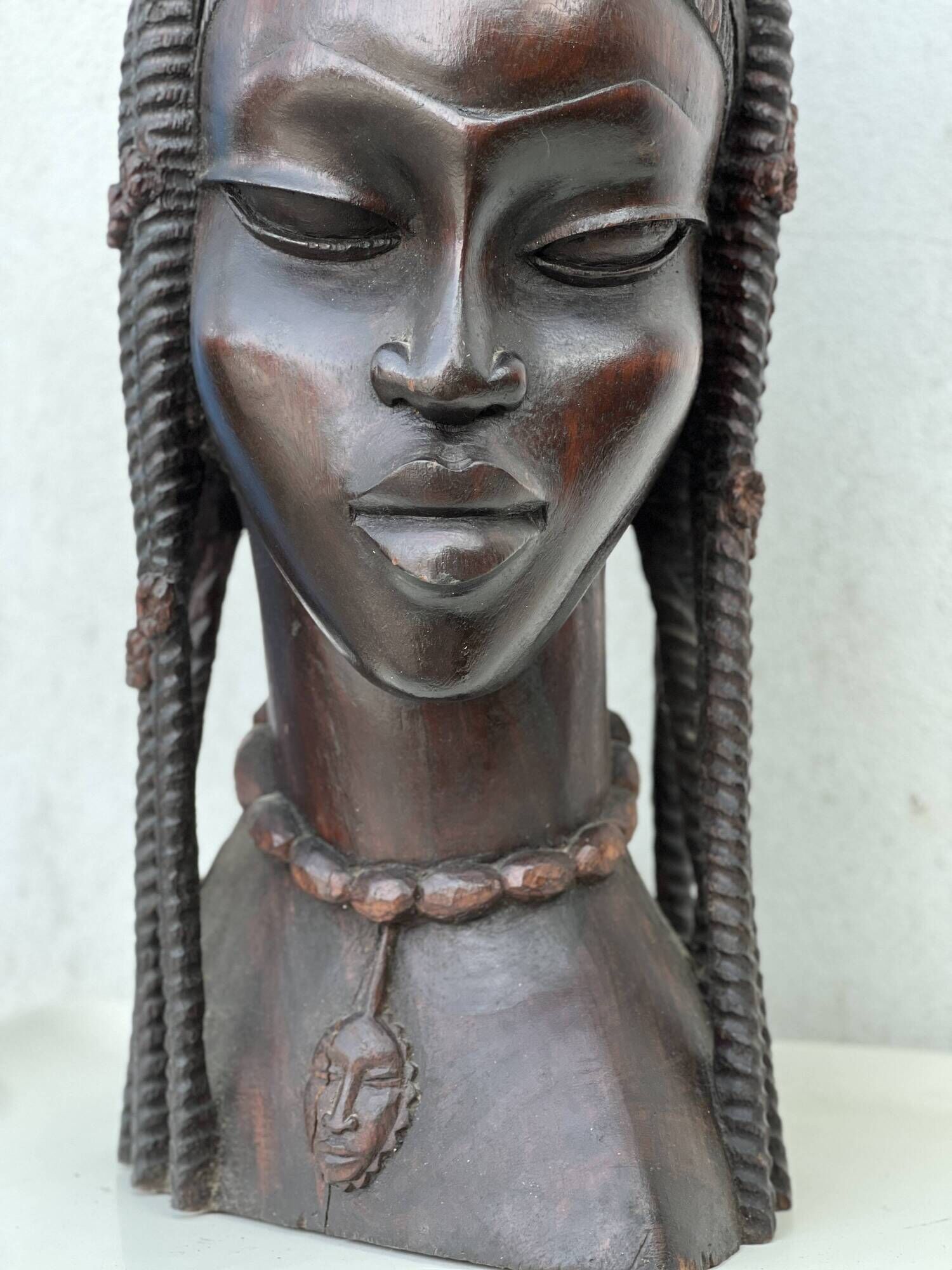 Large wooden bust of an African woman.
