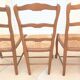 8 Straw chairs with high backs in solid wood