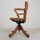 Oak office chair with adjustable spring system and height adjustment, 1950s.