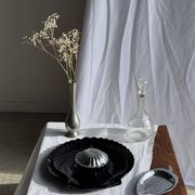 Pair of vintage black glass shell dishes D32 and D26