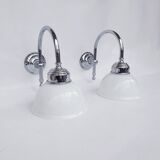 Swan neck and white glass wall lights