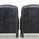 Set of 2 black cow leather armchairs finished with decorative nails, industrial style
