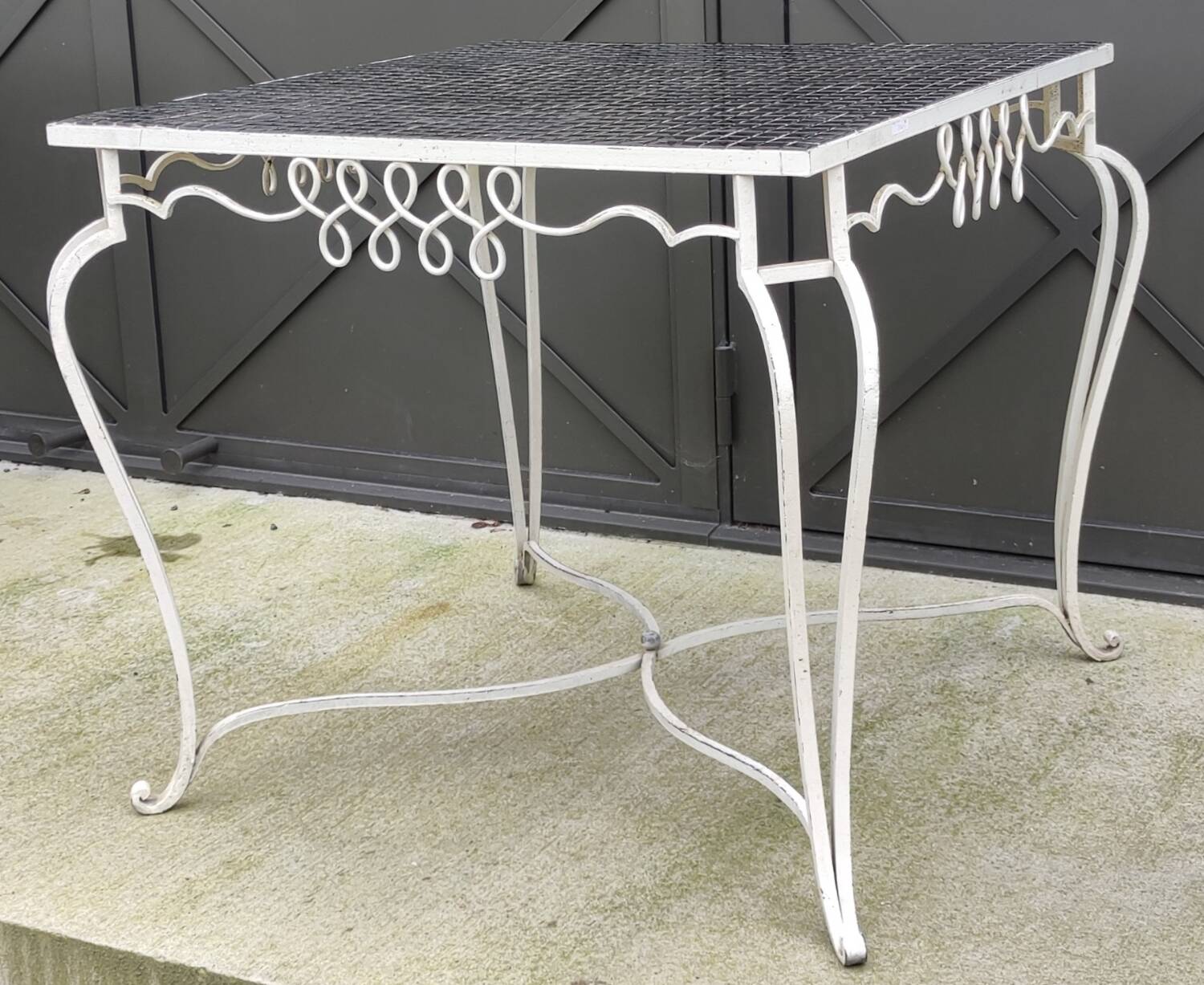 Old wrought iron table / ceramic tile top