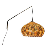 Mid-century modern Danish extendable cantilever wall lamp with a rattan shade, 1960s.