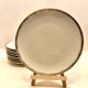 24 plates and a vintage porcelain dish decorated by Lucien Engel.