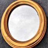 Oval mirror of 30 x 24 cm with its golden entourage of biedermeier