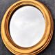 Oval mirror of 30 x 24 cm with its golden entourage of biedermeier