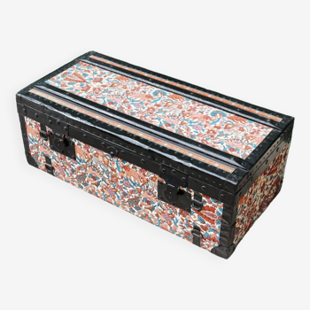 Old travel trunk in floral fabric