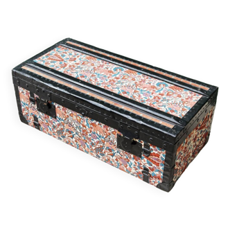 Old travel trunk in floral fabric