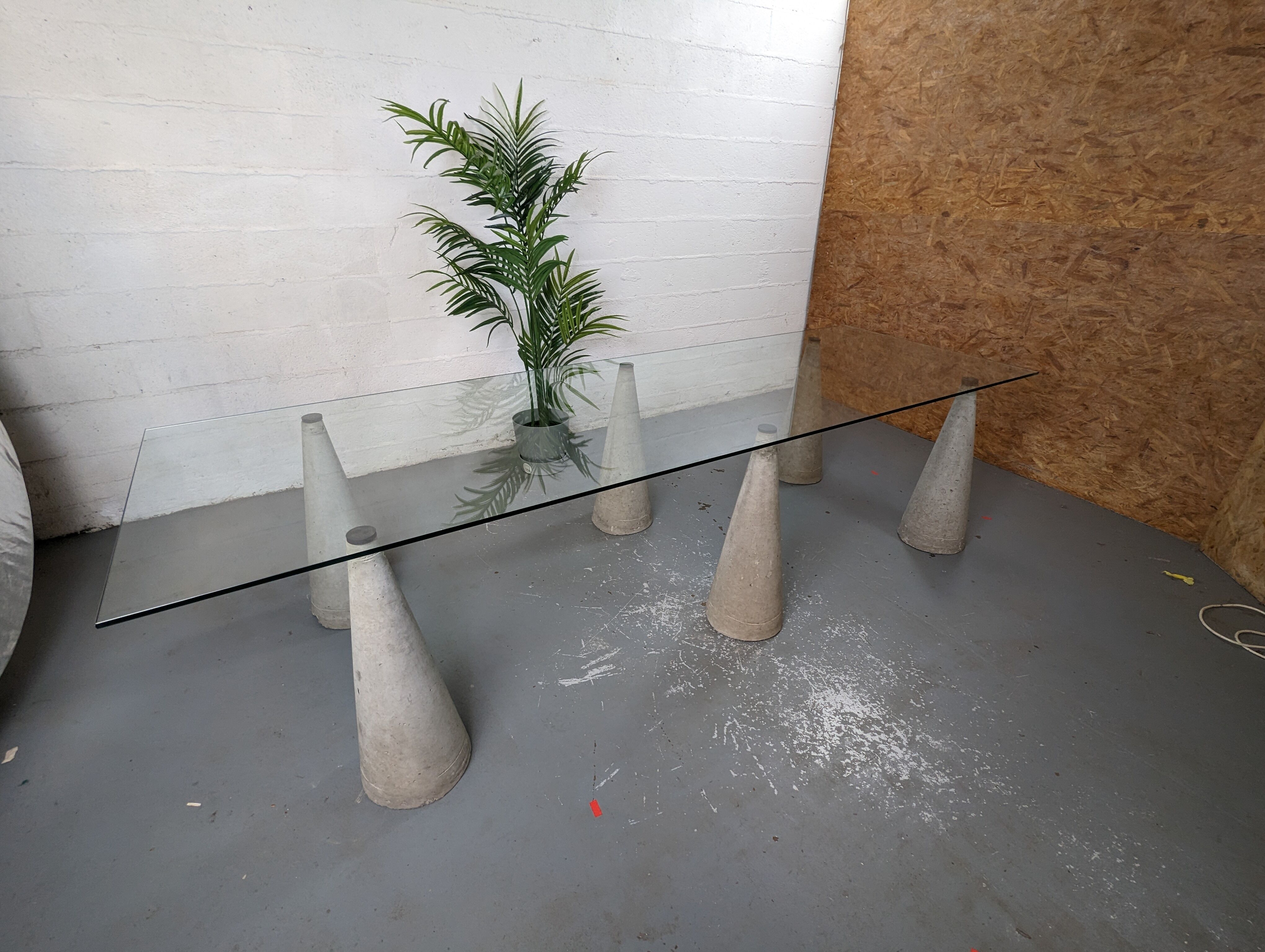 Glass table with cement legs