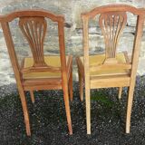 Pair of old chairs with brass elements