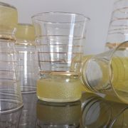 Old pitcher with its 8 yellow granite glasses with gold edging vintage 50's